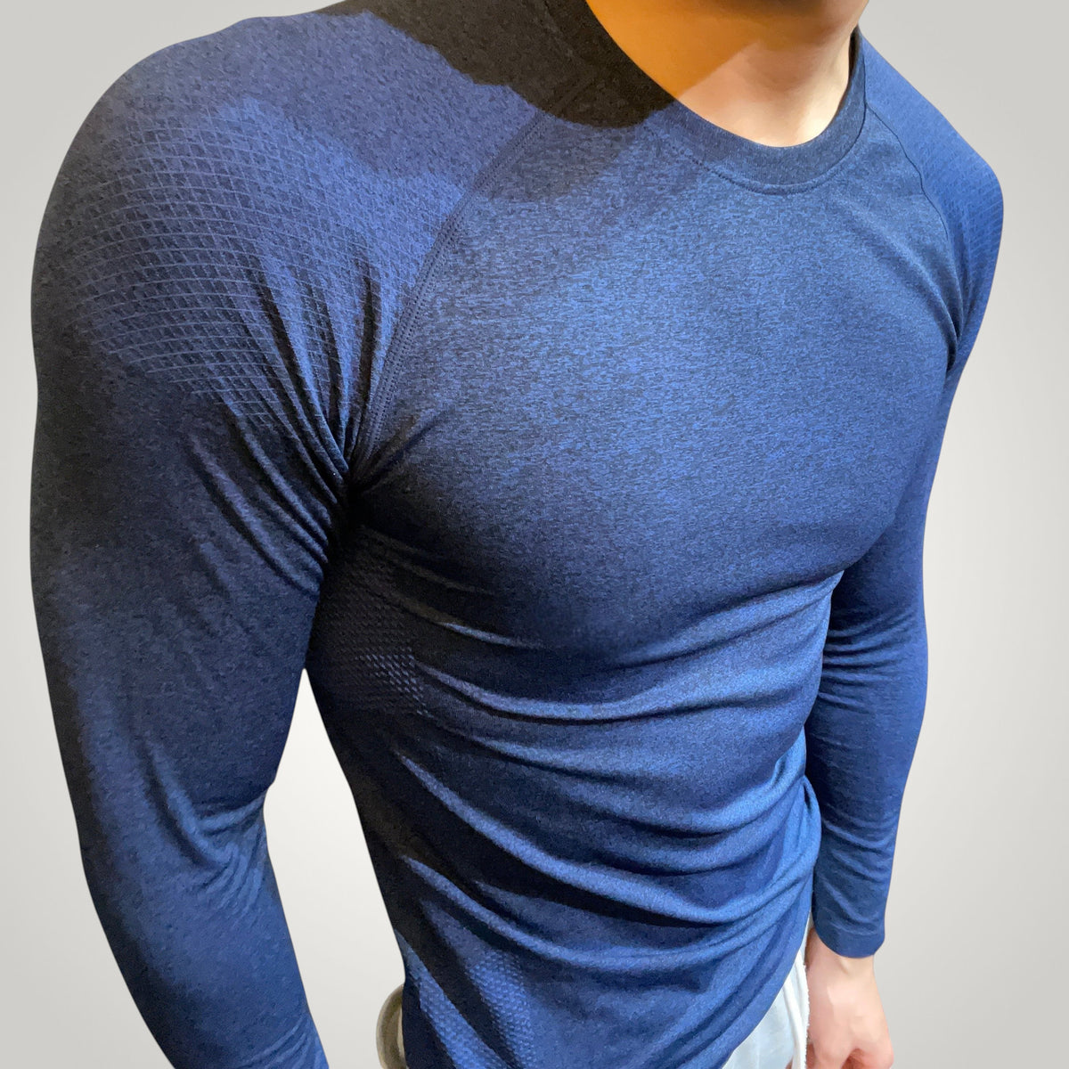 ASCEND navy compression long sleeve tee with textured shoulder detailing for a muscular fit during training
