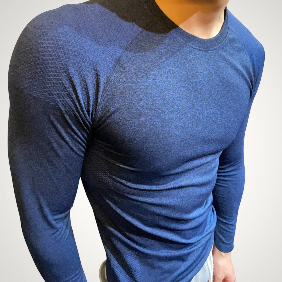 ASCEND navy compression long sleeve tee with textured shoulder detailing for a muscular fit during training