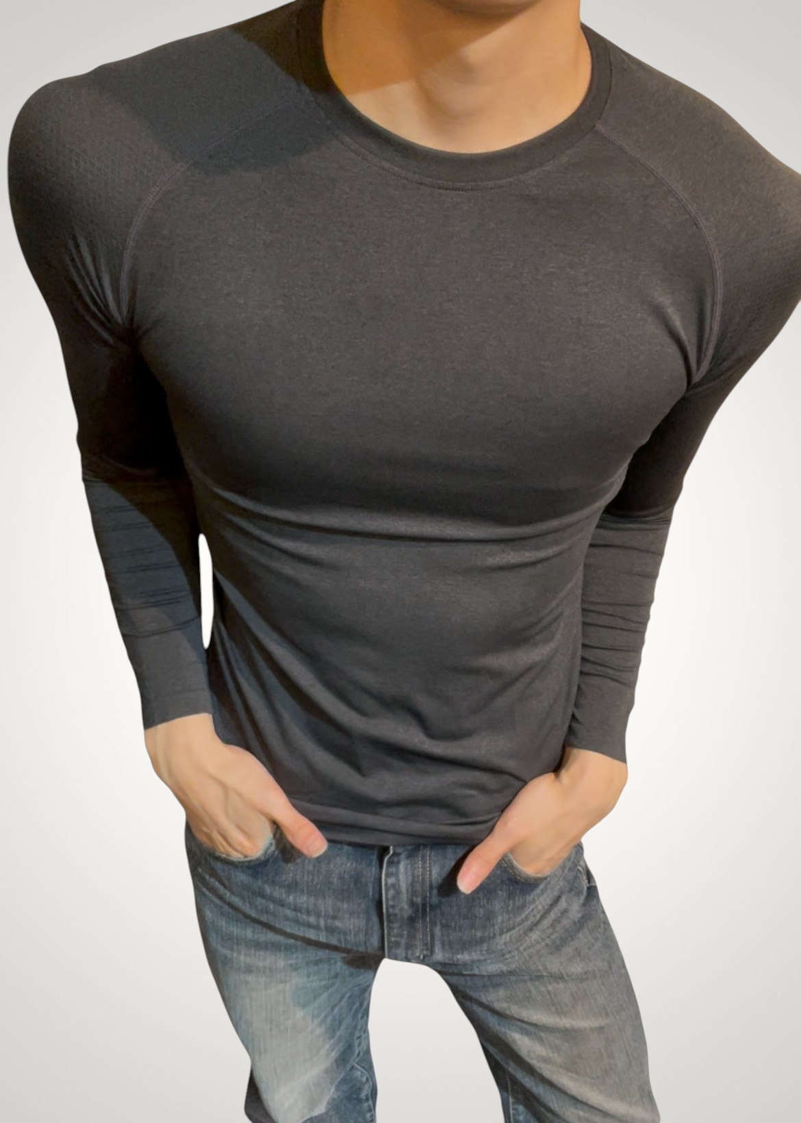ASCEND black compression long sleeve tee with seamless shoulder detailing on a male model