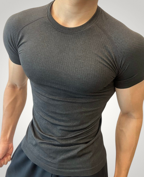 ASCEND black seamless compression tee with jacquard texture, designed for a fitted athletic look during training.