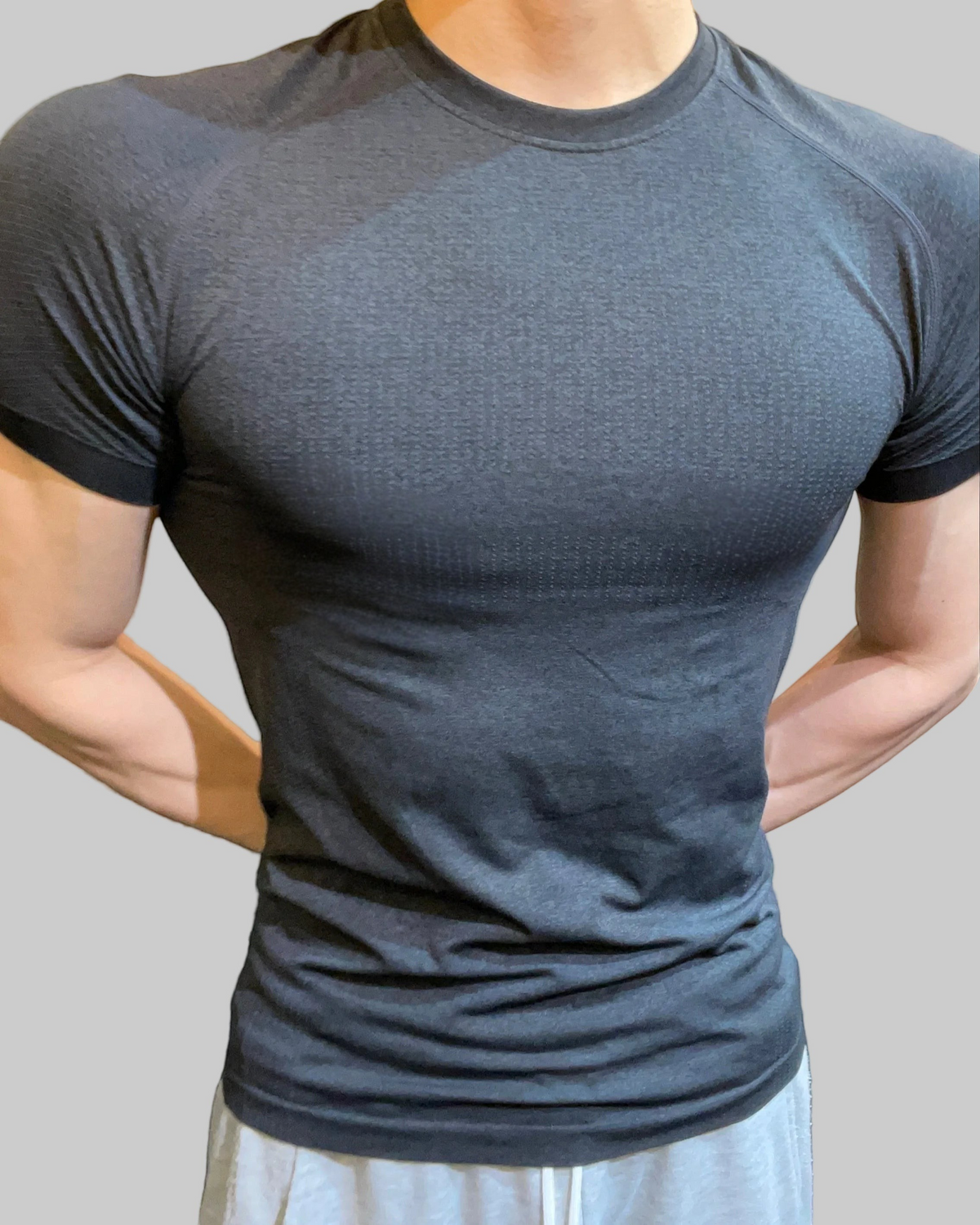 ASCEND black seamless compression tee with a tight fit, designed for athletic training and muscle definition.