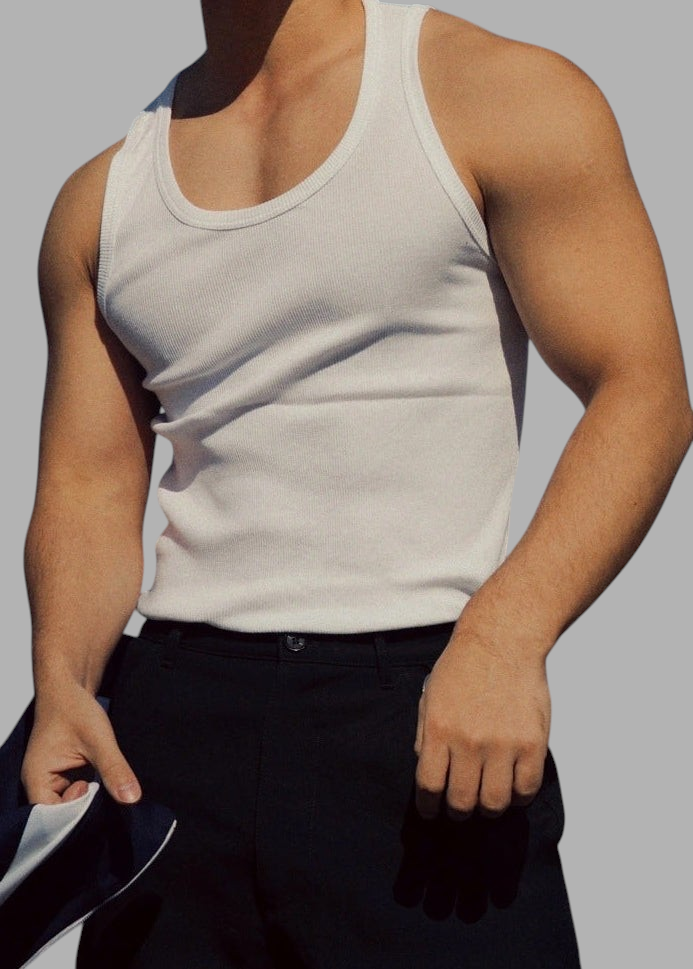 ASCEND white ribbed compression tank tee worn by a muscular man, showcasing a fitted athletic silhouette.