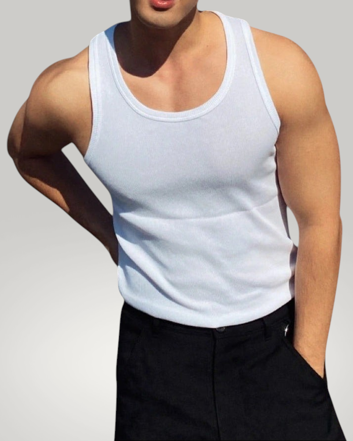 ASCEND white ribbed compression tank top worn by a muscular man with black trousers