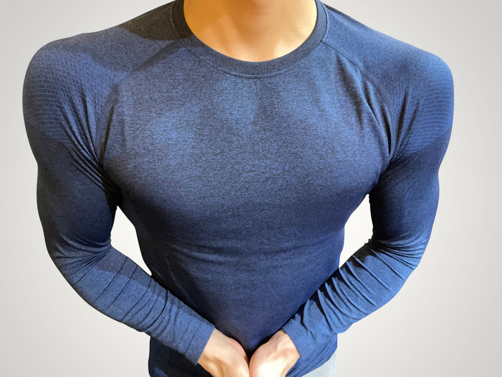 ASCEND navy compression long sleeve tee with textured shoulder detailing for a muscular fit during training.