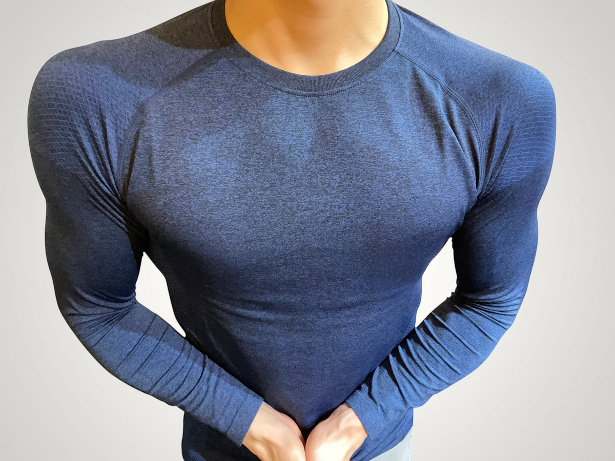 ASCEND navy compression long sleeve tee with textured shoulder detailing for a muscular fit during training.